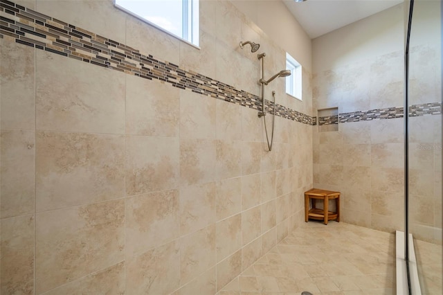 bathroom with a tile shower