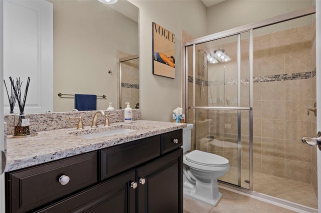 bathroom with vanity, a stall shower, and tile patterned flooring