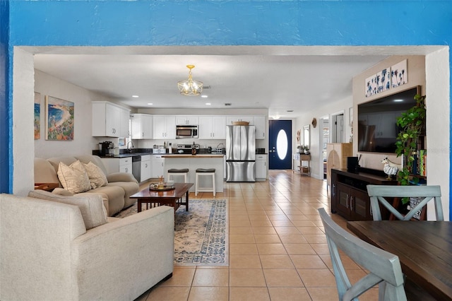 living room featuring light tile patterned floors and recessed lighting