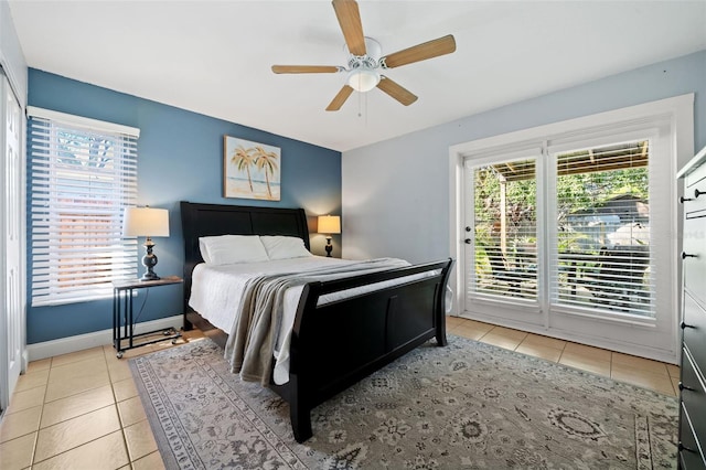 bedroom with access to outside, light tile patterned floors, baseboards, and ceiling fan