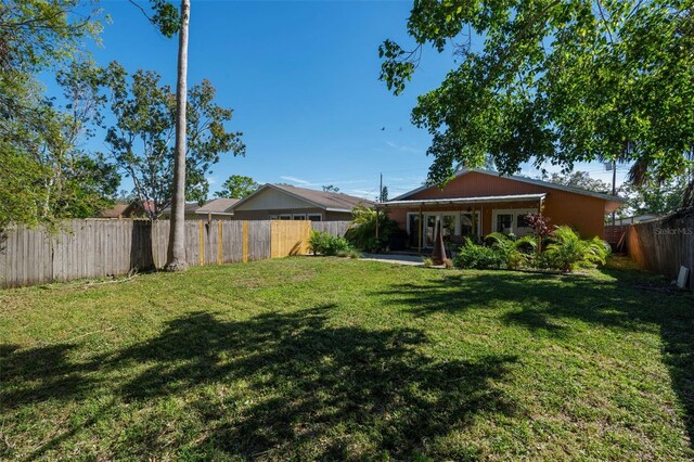 view of yard with a fenced backyard