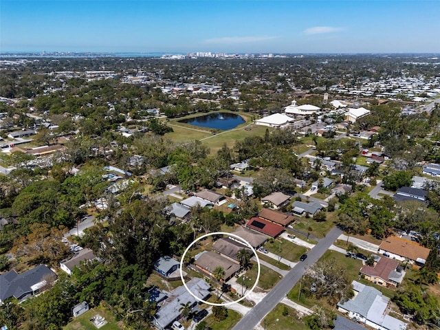 drone / aerial view with a residential view and a water view