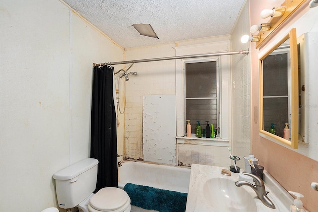 full bath with a textured ceiling, vanity, toilet, and shower / tub combo with curtain