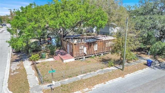 view of front of property featuring fence