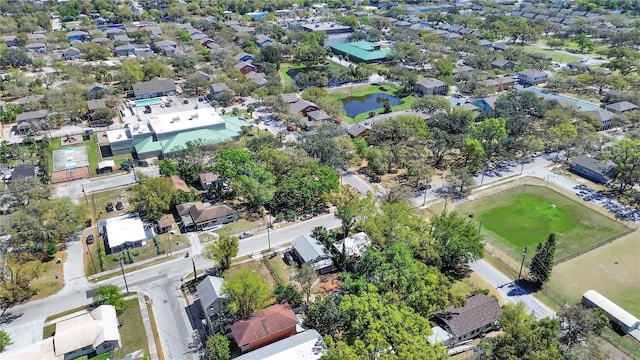 aerial view with a residential view and a water view