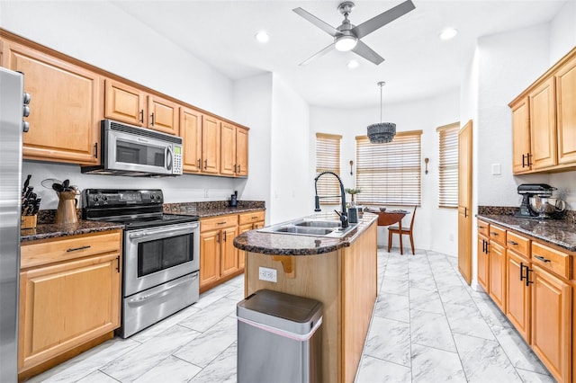 kitchen with stainless steel appliances, recessed lighting, marble finish floor, and a sink