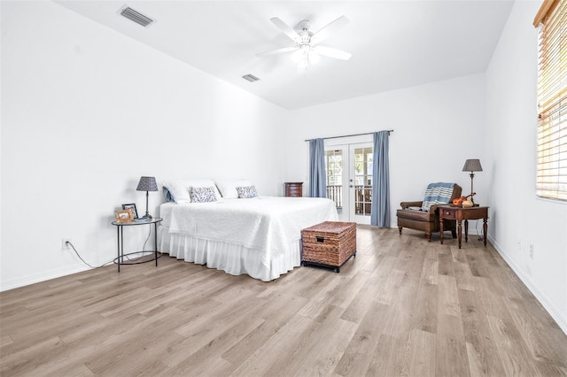 bedroom with access to outside, french doors, visible vents, and light wood-style flooring