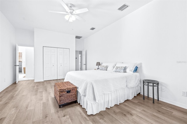 bedroom with visible vents, light wood-style flooring, and baseboards