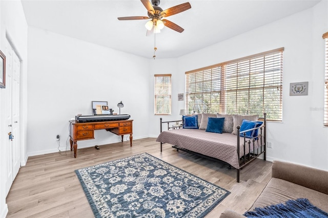 sitting room featuring light wood-type flooring and baseboards