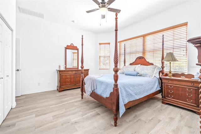 bedroom with ceiling fan, baseboards, visible vents, and light wood-style floors