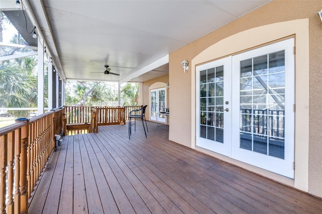 wooden deck featuring french doors and ceiling fan