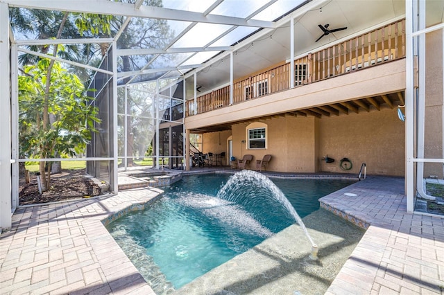 outdoor pool with a lanai and a patio