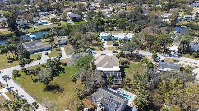 aerial view featuring a water view and a residential view