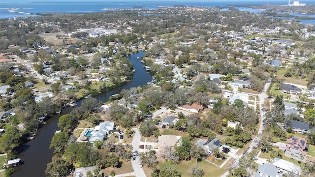 drone / aerial view featuring a water view and a residential view