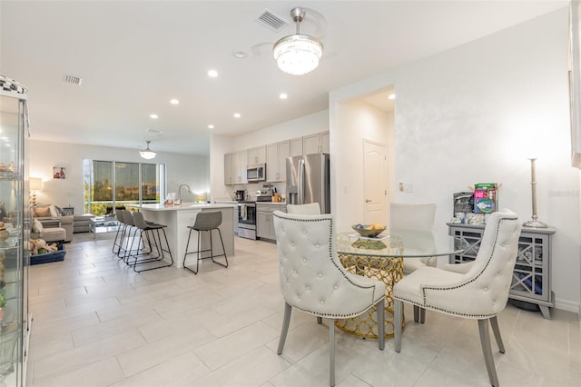 dining room featuring visible vents and recessed lighting