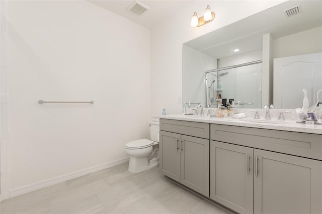 full bathroom featuring double vanity, visible vents, toilet, a stall shower, and a sink