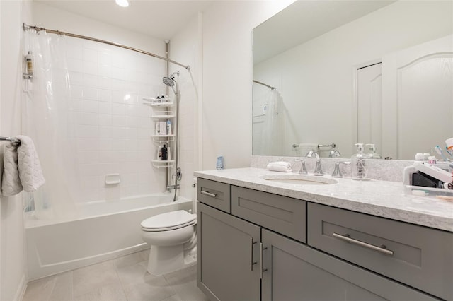 bathroom featuring vanity, tile patterned flooring, shower / bath combination with curtain, and toilet