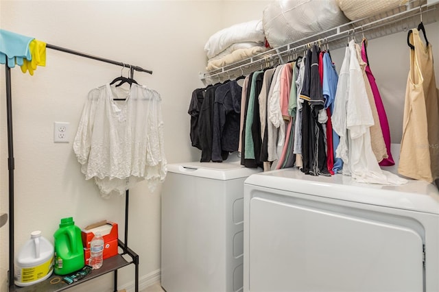 washroom featuring laundry area and washer and dryer