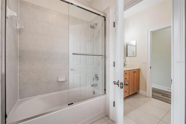 2665 Lakebreeze Ln N, Clearwater, FL 33759 - bathroom featuring vanity, tile patterned floors, and enclosed tub / shower combo