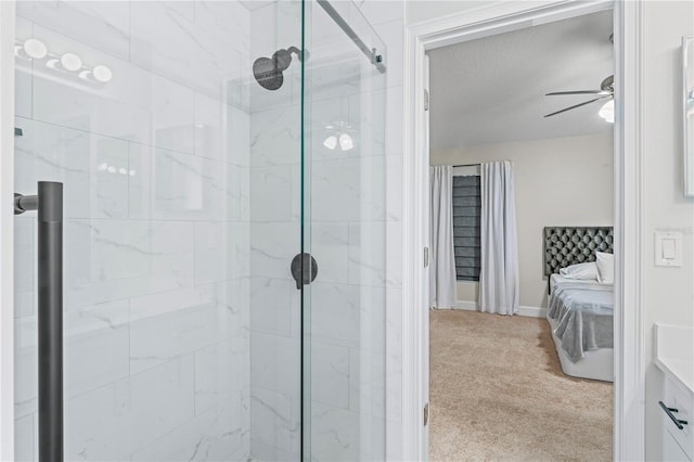 bathroom with ceiling fan, a shower stall, and ensuite bath