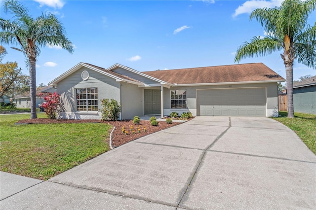 ranch-style house featuring concrete driveway, a front lawn, an attached garage, and stucco siding