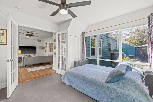 bedroom with french doors and ceiling fan