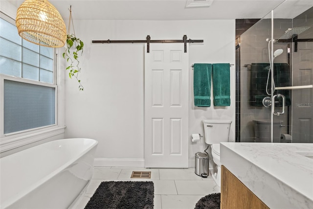 full bathroom featuring toilet, a soaking tub, a shower stall, and vanity