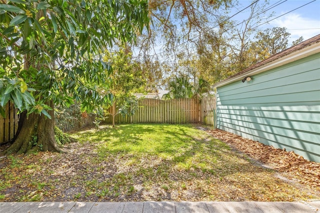 view of yard with a fenced backyard