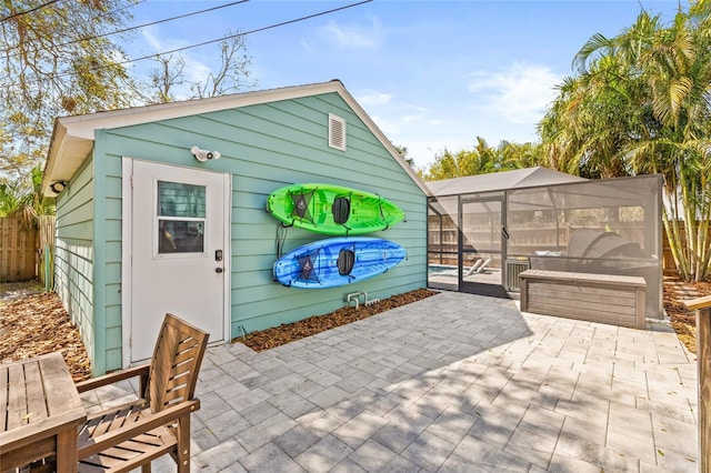 view of outdoor structure with an outbuilding, a swimming pool, and a fenced backyard