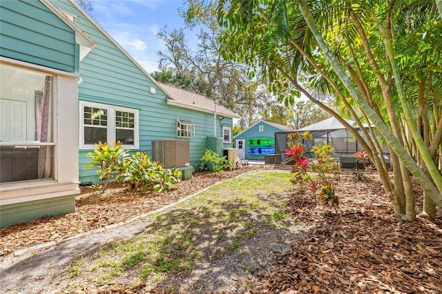 view of yard with a lanai