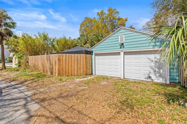 garage with fence