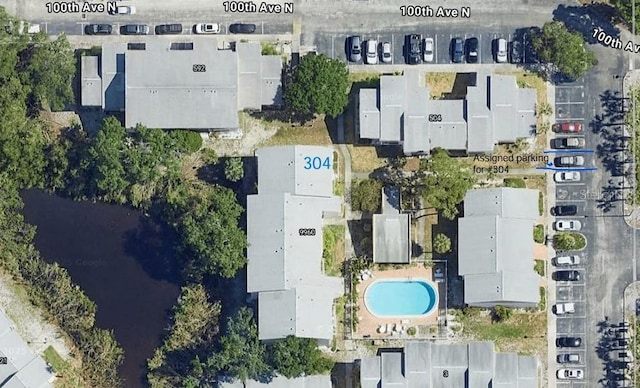 9960 5th St N Unit 304, Saint Petersburg, FL 33702 - aerial view of property and surrounding area featuring a pool area