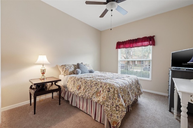 carpeted bedroom with a ceiling fan and baseboards