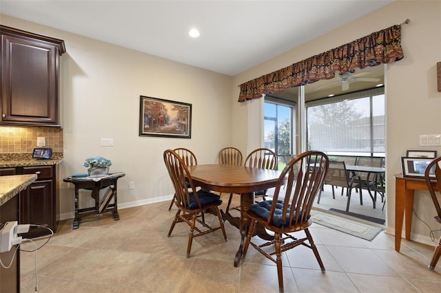 dining room with light tile patterned floors, recessed lighting, and baseboards