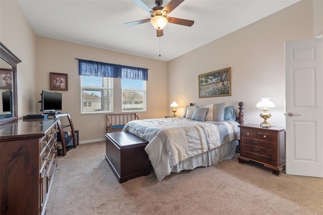 bedroom with light carpet, ceiling fan, and baseboards