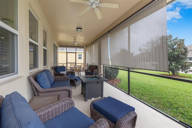 sunroom / solarium featuring a ceiling fan