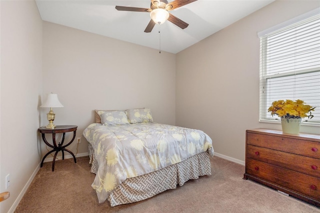 bedroom featuring a ceiling fan, carpet flooring, and baseboards