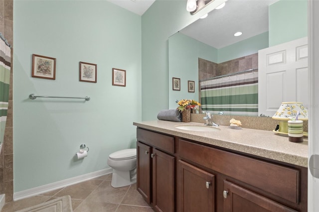 full bath with toilet, vanity, baseboards, tiled shower, and tile patterned floors