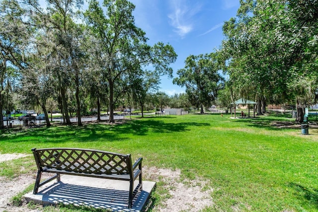 surrounding community with a yard