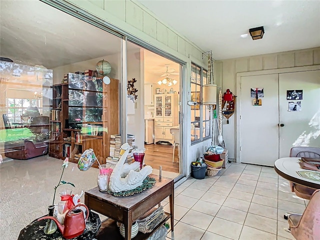 sunroom / solarium with an inviting chandelier