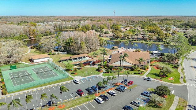 bird's eye view with a water view and a forest view