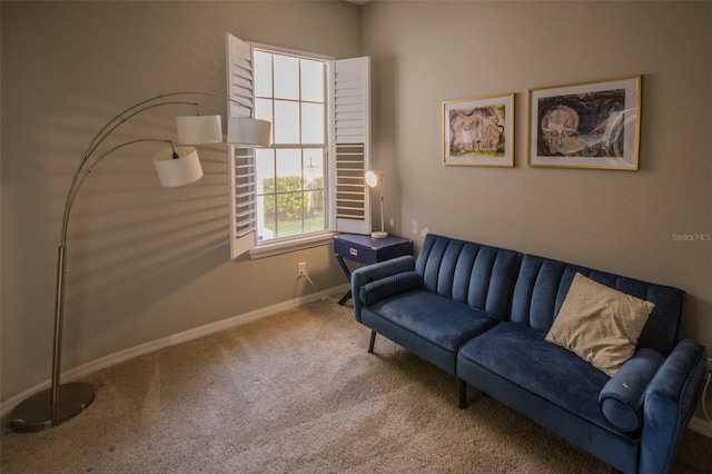 sitting room with carpet flooring and baseboards