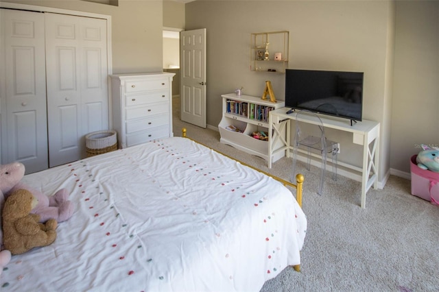 bedroom with carpet floors, a closet, and baseboards