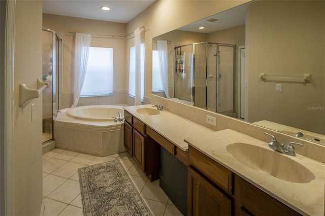 full bathroom with tile patterned flooring, a sink, and a shower stall