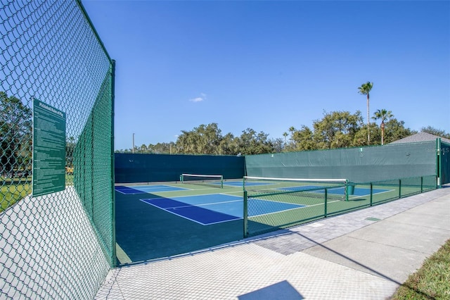 view of tennis court with fence