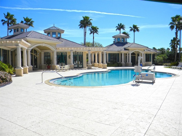 pool with a patio and french doors