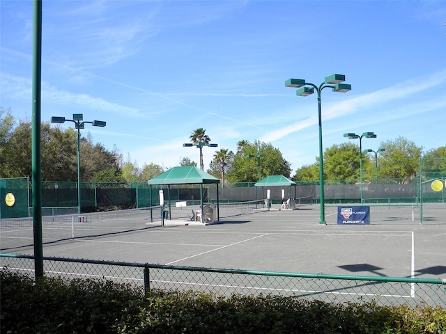 view of sport court with fence