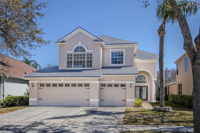 17923 Timber View St, Tampa, FL 33647 - traditional-style house featuring an attached garage, french doors, stucco siding, and driveway