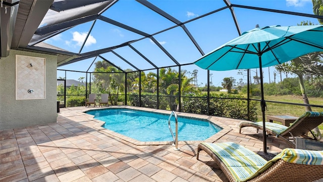 pool with a patio area and glass enclosure