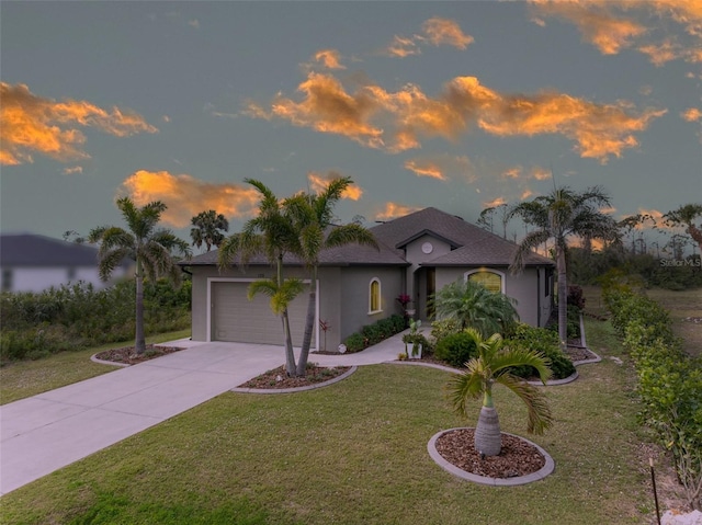 view of front facade featuring concrete driveway, a garage, a front yard, and stucco siding